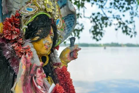  A Devi Maa Durga sadly looks down with tousled hair while tears flow the ... Stock Photos