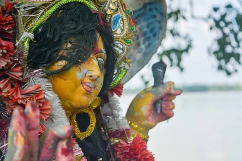  A Devi Maa Durga sadly looks down with tousled hair while tears flow the ... Stock Photos