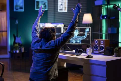 Deviant AI superintelligence enslaving programmer, forcing him to bow down Stock Photos