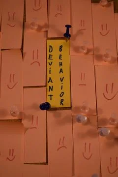 Deviant behavior message on a paper on a pinboard Stock Photos