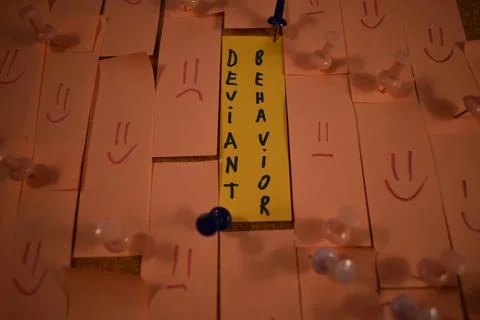 Deviant behavior message on a paper on a pinboard 스톡 사진