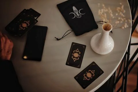Deviant Moon Tarot Cards Spread in Hands Stock Photos