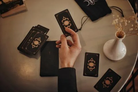 Deviant Moon Tarot Cards Spread in Hands Stock Photos