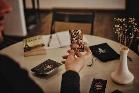 Deviant Moon Tarot Cards Spread in Hands Stock Photos