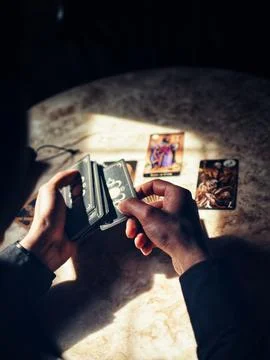 Deviant Moon Tarot Cards Spread in Hands Stock Photos