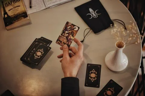 Deviant Moon Tarot Cards Spread in Hands Stock Photos