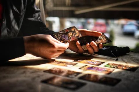 Deviant Moon Tarot Cards Spread in Hands Stock Photos