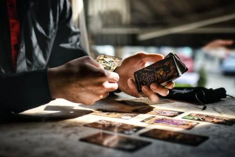 Deviant Moon Tarot Cards Spread in Hands Stock Photos