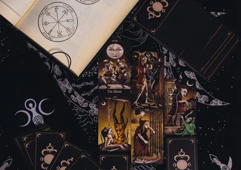 Deviant Moon Tarot Cards Spread in Hands Stock Photos