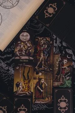 Deviant Moon Tarot Cards Spread in Hands Stock Photos