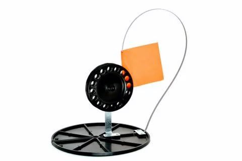 Device for catching predatory fish from the ice, white background close-up Stock Photos