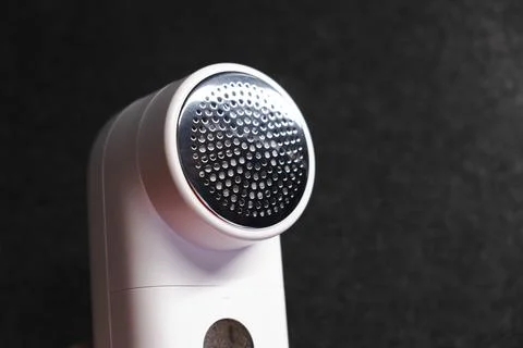 Device for cleaning clothes from pellets. Stock Photos