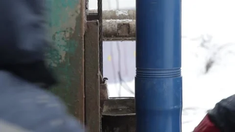 The device connects blue threaded pipes Stock Footage 145594581