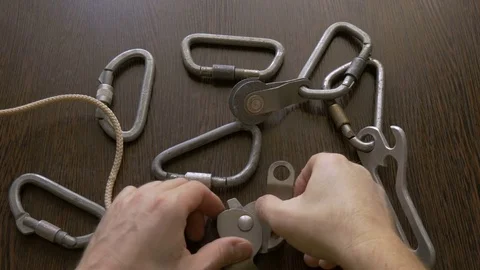 Device for descent from a rock. It is fastened to a carbine, it is checked Stock Footage 73580819