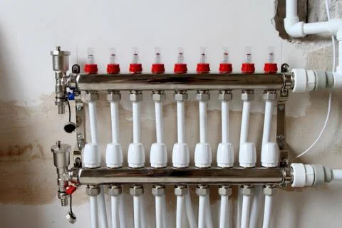 Device for distributing warm water supply. Stock Photos