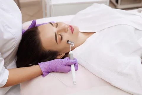 The device is facial cosmetology. Stock Photos