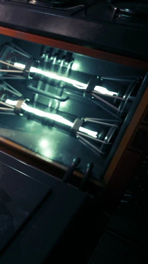 Device with glowing tubes in a workshop during the evening hours Stock Footage 339043861