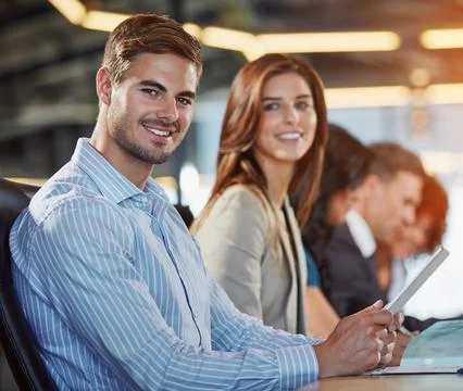 This device makes note taking so easy. Portrait of a businessman in a meeting Stock Photos
