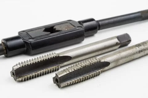 Device for making threads in a screw. Metalworking accessories. Stock Photos