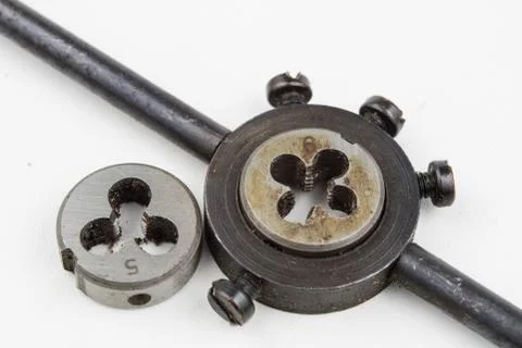 Device for making threads in a screw. Metalworking accessories. Stock Photos