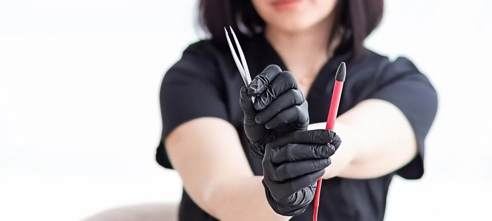 A device for the method of electric shock epilation in the hands of a femal.. Stock Photos