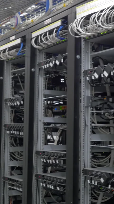 Device for mining crypto currency. Row of bitcoin miners set up on the wired Stock Footage 281499604
