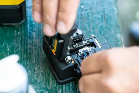 Device for mounting optical cable. Optical internet Technology concept. Stock Photos