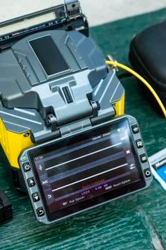 Device for mounting optical cable. Optical internet Technology concept. Stock Photos