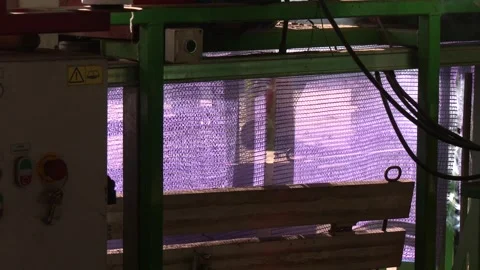 Device for quick loading of vegetables into mesh bags. Stock-Footage 296086561