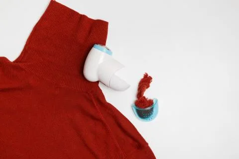 Device for removing lint from wool clothes. Golf with fuzz ball isolated on Stock Photos
