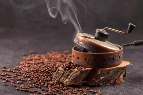 The device for roasting coffee beans, an old hand grinder. 스톡 사진