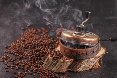 The device for roasting coffee beans, an old hand grinder. Photos