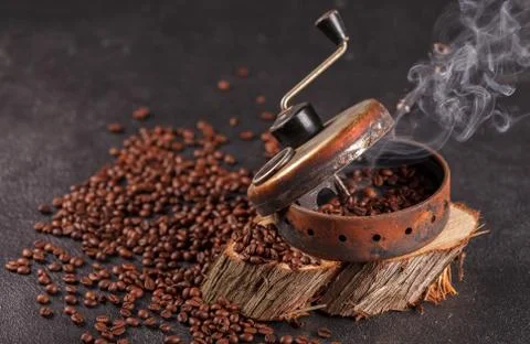 The device for roasting coffee beans, an old hand grinder. 스톡 사진