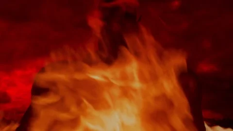 Devil amid flames outside town or city Stock Footage