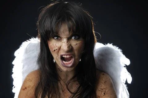 Devil angel in Halloween Devil with angelic wings and blood in mouth ,mode... Stock Photos