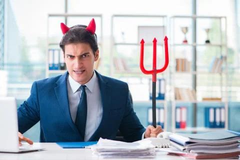 Devil angry businessman in the office Stock Photos
