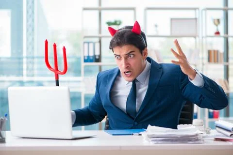 Devil angry businessman in the office Stock Photos