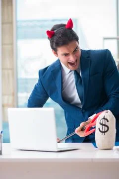 Devil angry businessman in the office Stock Photos