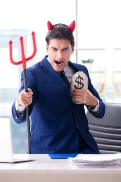 Devil angry businessman in the office Stock Photos