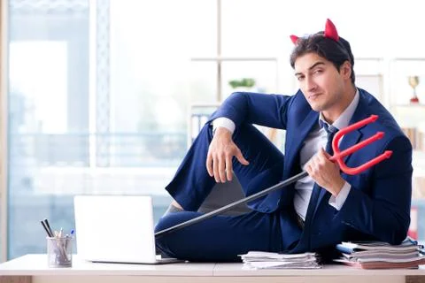 Devil angry businessman in the office Stock Photos