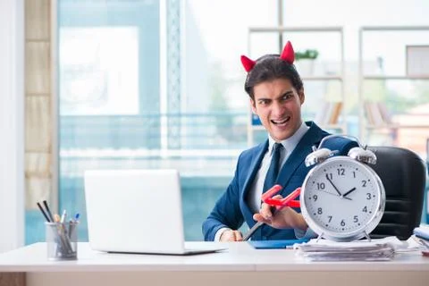 Devil angry businessman in the office Stock Photos
