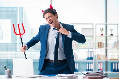 Devil angry businessman in the office Stock Photos