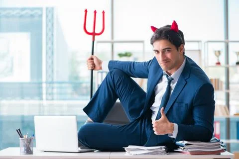 Devil angry businessman in the office Stock Photos