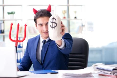Devil angry businessman in the office Stock Photos