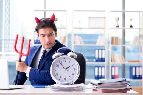 Devil angry businessman in the office Stock Photos