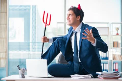 Devil angry businessman in the office Stock Photos