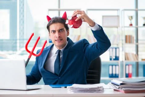 Devil angry businessman in the office Stock Photos