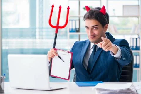 Devil angry businessman in the office Stock Photos