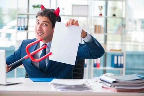 Devil angry businessman in the office Stock Photos