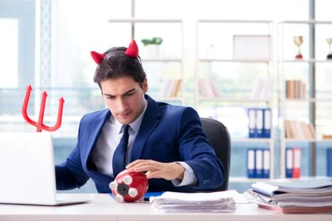 Devil angry businessman in the office Stock Photos